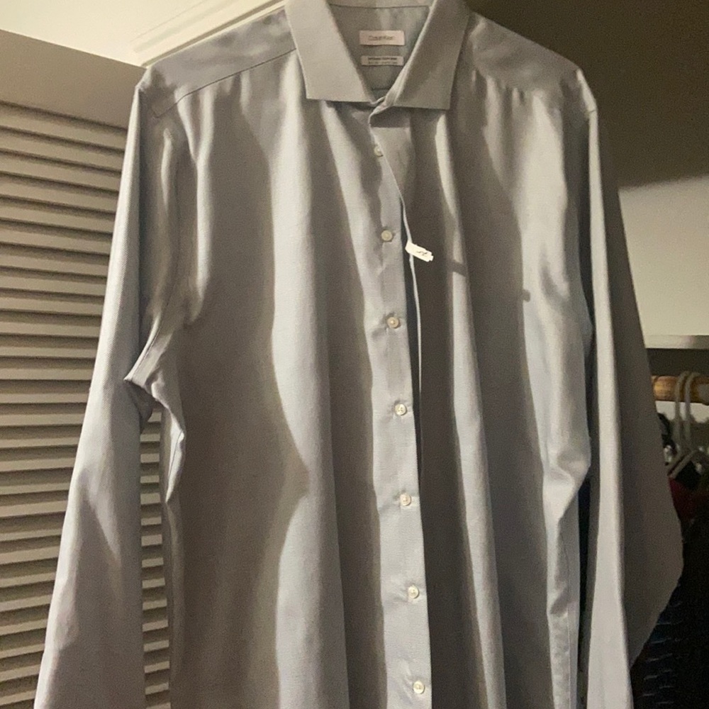 Men’s light blue Calvin Klein button down dress shirt